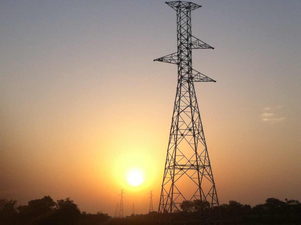 Transmission tower at sunset